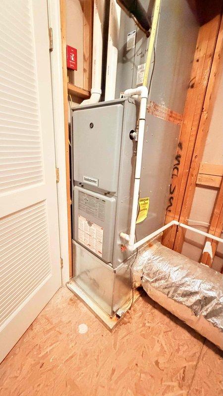 Performed comprehensive assessment of existing air conditioning system that is over 15 years old and currently not functioning properly. Evaluated existing air handler unit located in utility space and reviewed current thermostat operation displaying indoor temperature of 69° with outdoor conditions at 52°. Presented multiple replacement options for complete AC system upgrade to address failed equipment and provide improved cooling performance and efficiency for owner-occupied residence.