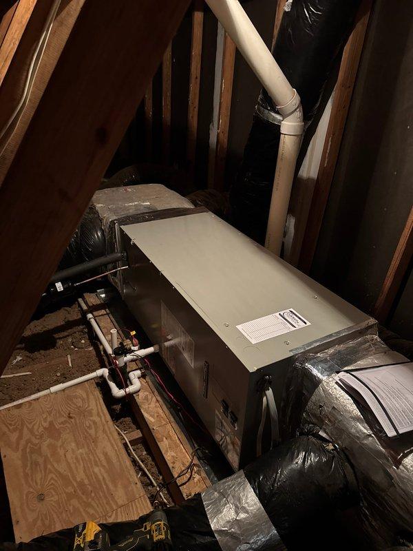Completed full HVAC system replacement including removal and disposal of existing equipment. Installed 3-ton 14 SEER heat pump system consisting of outdoor condenser unit mounted on existing pad, standard fan coil unit with 15KW backup heater and breaker positioned in attic drain pan with shutoff valve, and Honeywell S1200 WiFi thermostat. Ran electrical whip and disconnect to outdoor unit, flushed and pressure tested refrigerant lines, and fully charged system to manufacturer specifications. All equipment tested and operational upon completion.