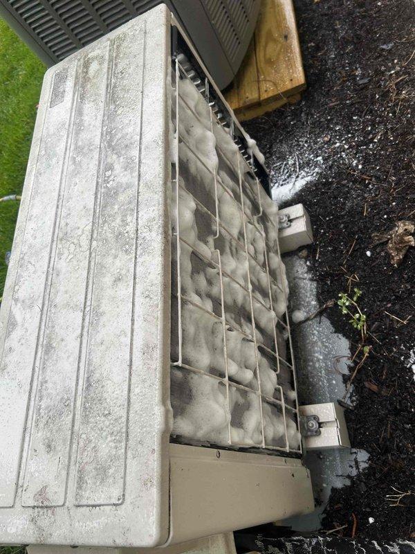 Performed preventive maintenance inspection on ductless mini-split system as part of post-installation agreement coverage. Evaluated outdoor condenser unit condition, noting accumulated debris and weathering on exterior surfaces and coil assembly. Recorded indoor temperature readings at 68.5°F to verify system performance and proper operation of heating/cooling functions.