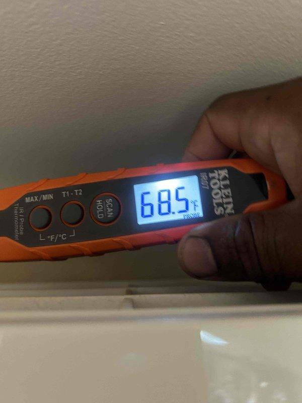 Performed preventive maintenance inspection on ductless mini-split system as part of post-installation agreement coverage. Evaluated outdoor condenser unit condition, noting accumulated debris and weathering on exterior surfaces and coil assembly. Recorded indoor temperature readings at 68.5°F to verify system performance and proper operation of heating/cooling functions.