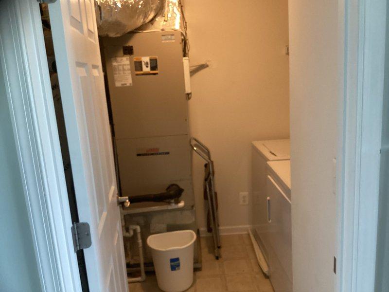 Performed site evaluation of existing HVAC system for replacement quote. Inspected current air handler unit mounted in utility closet with flexible ductwork, condensate drainage, and electrical connections. Documented system configuration including ductwork layout, equipment placement constraints, and existing infrastructure to provide accurate replacement system specifications and sizing recommendations.