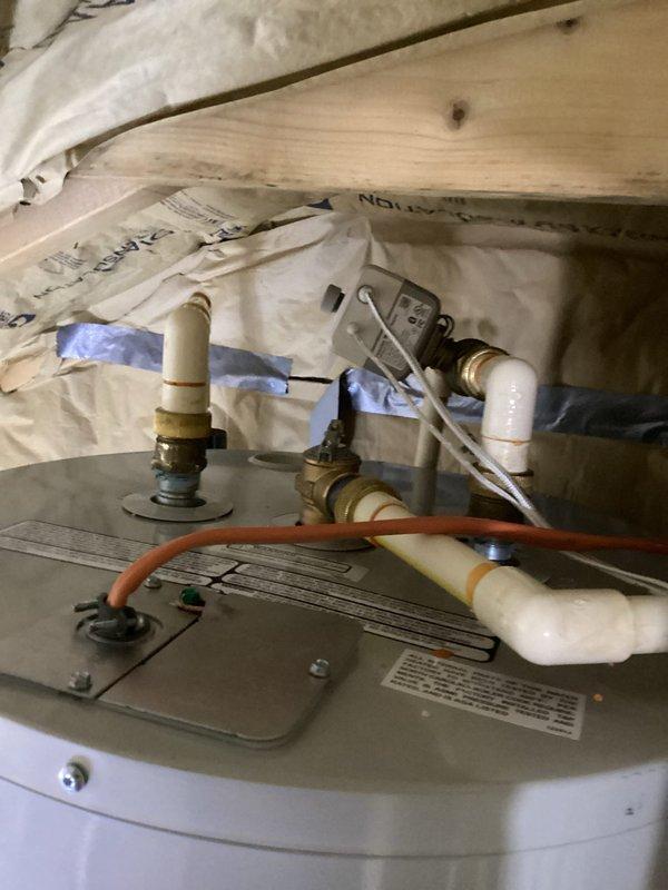 Successfully replaced a 50-gallon tall water heater in an attic location requiring a two-person crew due to access constraints and unit dimensions. Removed the existing water heater and installed a new 50-gallon tall unit measuring 58"H x 20"W, which fit perfectly within the available space between framing members.

Installation included a complete drain pan for leak protection, new expansion tank for thermal expansion control, and all necessary brass fittings including 3/4" tee, 3/4" 90-degree elbow, 3/4" x 4" and 3/4" x 6" nipples, three 3/4" high-temperature male adapters, and two 18" flexible water connectors for secure supply line connections. All plumbing connections were properly fitted with brass components to ensure durability and code compliance.

The installation was completed over four hours with proper staging of materials and equipment. All connections were tested for leaks, and the unit was verified operational upon completion.