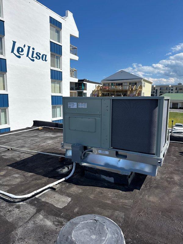 Completed full rooftop packaged unit replacement, removing and disposing of existing equipment. Installed American Standard EDK060A3E0A000 5-ton air conditioning unit with BAYHTFA320A 20KW heater package on new roof curb with proper adapter fittings. Fabricated and installed transition fittings to adapt new unit to existing trunk duct system. Crane service utilized for safe equipment removal and installation on commercial flat roof. Installed Honeywell TH6320WF WiFi thermostat for enhanced system control and remote access capabilities. All electrical connections, refrigerant lines, and ductwork transitions completed to manufacturer specifications. System tested and verified operational with proper airflow and temperature differential. One-year parts and labor warranty provided on complete new system installation.