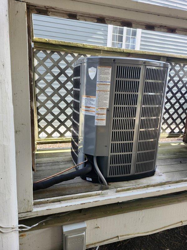 Completed full HVAC system replacement including removal and disposal of existing equipment. Installed 5A6H7036 17 SEER heat pump outdoor unit on existing stand with SaltShield Heresite coating applied for corrosion protection. Installed 5TEM6D04 variable speed fan coil unit in drain pan with shutoff valve and BAYHTR1715BRKR 15KW heater with breaker. Furnished and installed transition fittings to adapt new equipment to existing trunk duct system. Sealed return duct around stairwell and inspected all ductwork to ensure no air leaks present. Flushed, pressure tested, and recharged refrigeration lines to manufacturer specifications. Installed two Honeywell TH6320WF WiFi thermostats for system control. Completed any necessary carpentry, patching, and painting around access points. Performed maintenance service on both first and second floor systems upon completion of installation.