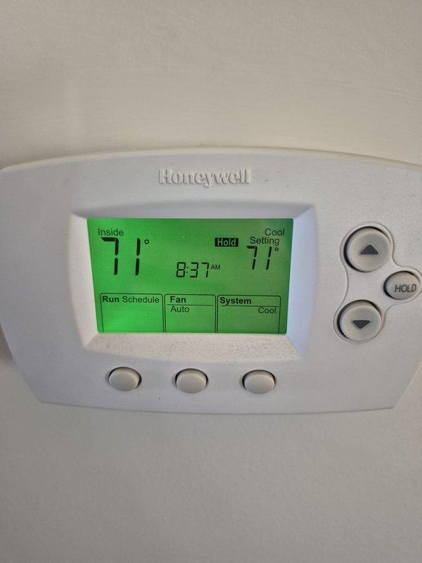 Completed scheduled cooling maintenance visit on HVAC system. Verified Honeywell programmable thermostat operation, confirming proper temperature control, display functionality, and system cycling between cooling modes. Unit operating within normal parameters with thermostat maintaining setpoint temperatures and responding appropriately to user inputs.