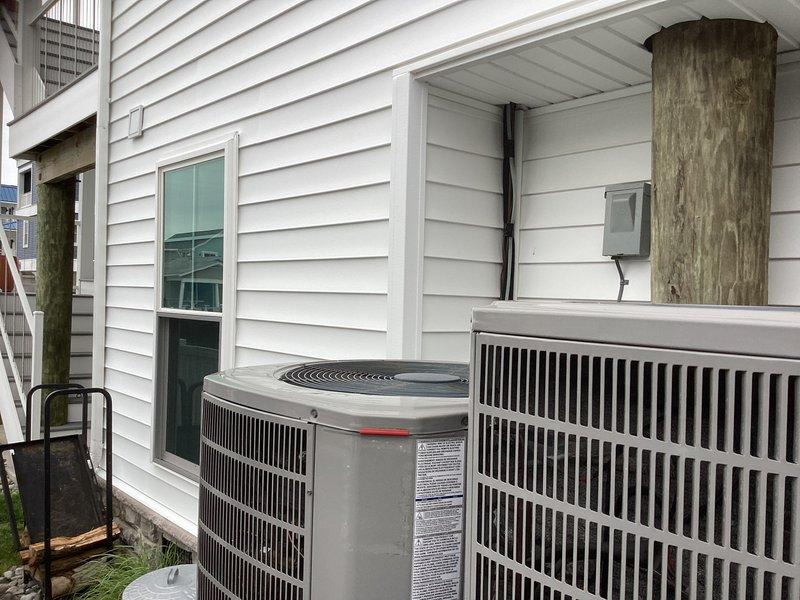 Completed installation of Mitsubishi ductless mini-split system consisting of MUZ-FX09NL outdoor condensing unit and MSZ-FX09NL indoor fan coil unit. Mounted outdoor unit on stainless steel wall bracket on east exterior wall adjacent to existing HVAC equipment. Installed indoor fan coil on closet wall in ground floor gym area. Ran refrigerant lines, condensate drain, and low voltage control wiring between indoor and outdoor units with proper insulation and support. Installed surge disconnect at outdoor unit location. System tested and confirmed operational with proper refrigerant charge and airflow. Customer responsible for final power wiring connection. One-year parts and labor warranty provided on ductless equipment.