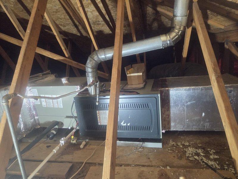 Removed and disposed of existing outdoor air conditioning unit and evaporator coil. Installed 4-ton, 14 SEER heat pump (model 5A6H4048) on exterior platform and mounted new evaporator coil (model 5TXCC007) to interface with existing furnace, converting system to dual fuel operation. Sealed leaking seams in supply ductwork located in attic space to improve system efficiency and prevent conditioned air loss. Flushed existing refrigeration lines, performed pressure testing to verify system integrity, and recharged with appropriate refrigerant to manufacturer specifications. Furnished and installed electrical whip and disconnect at outdoor unit per code requirements. Installed S1200W WiFi-enabled dual fuel thermostat to provide smart temperature control and optimize switching between heat pump and furnace operation based on efficiency parameters.