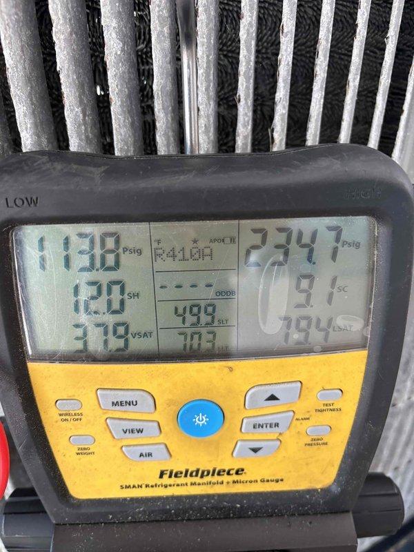 Responded to emergency no-cooling call on system less than ten years old. Upon arrival, connected refrigerant manifold gauges and performed system diagnostics, revealing low subcooling of 4.1°F and superheat of 12.0°F with suction pressure at 113.8 PSIG and liquid line pressure at 234.7 PSIG, indicating insufficient refrigerant charge. Inspected insulated refrigerant line set and confirmed proper installation with no visible damage or leaks. System was undercharged from factory installation or developed a slow leak over time, causing inadequate cooling performance and reduced capacity.