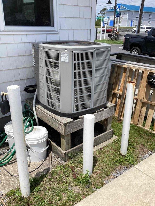 Responded to no cooling complaint at residential property. Upon inspection, found outdoor condenser unit with heavily soiled condenser coils and significant dust accumulation throughout cabinet. Internal components showed signs of age and neglect with dirt buildup on compressor, fan motor, and refrigerant lines. Performed thorough cleaning of condenser coils and interior components to restore proper airflow and heat transfer efficiency. Unit operational upon completion of service.
