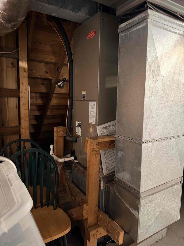 Conducted on-site evaluation of 30-year-old HVAC system located in basement for replacement estimate. Documented existing Bryant furnace and air handler equipment with photos, assessed current installation configuration including ductwork connections and PVC condensate drainage system. Customer is obtaining multiple estimates for complete system replacement.