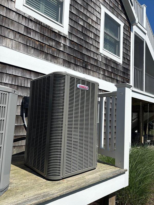 Completed full HVAC system replacement including removal and disposal of existing equipment. Installed new Lennox ML14KP1-024 2-ton 14 SEER heat pump with matching Lennox CBK45UHET-024 air handler in attic space and 10 kW electric heat pack. Fabricated and installed metal duct transitions to adapt new equipment to existing ductwork. Positioned outdoor condenser unit on existing pad with new electrical disconnect and whip. Reused existing refrigerant lines and condensate drain. Mounted Honeywell digital WiFi thermostat for system control. Installed Honeywell media air filter and provided two 20x20x4 replacement filters. All electrical connections completed to code. System tested and verified operational. One-year parts and labor warranty provided on both systems from installation date.