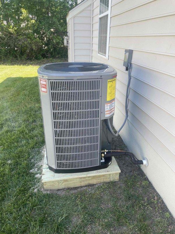 Completed full HVAC system replacement including removal and disposal of existing equipment. Installed American Standard 3.5-ton 16 SEER heat pump outdoor unit (model 5A6H5042) on wooden platform with whip, disconnect, and surge protection. Installed variable speed fan coil unit (model 5TEM6D05) in drain pan with shutoff valve and 15KW electric heat strip with breaker (model BAYHTR1715BRKR). Flushed, pressure tested, and recharged refrigeration lines to manufacturer specifications. Installed two WiFi thermostats (model S1200W) to control existing zone damper system—first floor thermostat controlling second floor zone and new thermostat for first floor zone. Utilized existing zone dampers and control board, which are not covered under new equipment warranty. System tested and operational with one-year parts and labor warranty on new equipment.