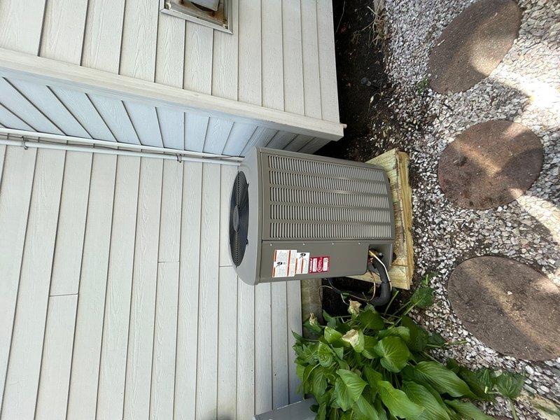 Completed full HVAC system replacement for upstairs zone. Removed and properly disposed of existing equipment. Installed new Lennox EL19KPV-036 3-ton 19 SEER variable speed heat pump outdoor unit on pressure-treated wood platform against exterior wall. Mounted CBK45UHVT-036 variable speed air handler indoors with filter access at unit. Integrated Lennox 10kW electric heat pack for supplemental heating capacity. Fabricated and installed metal duct transitions to adapt new equipment to existing ductwork infrastructure. Reused existing refrigerant lines and condensate drain piping. Replaced outdoor electrical disconnect and electrical whip to meet current code requirements. Installed Honeywell digital WiFi thermostat for remote system control and monitoring. Verified all electrical connections, refrigerant charge, airflow, and system operation. Unit tested and operating to manufacturer specifications. System ready for service.
