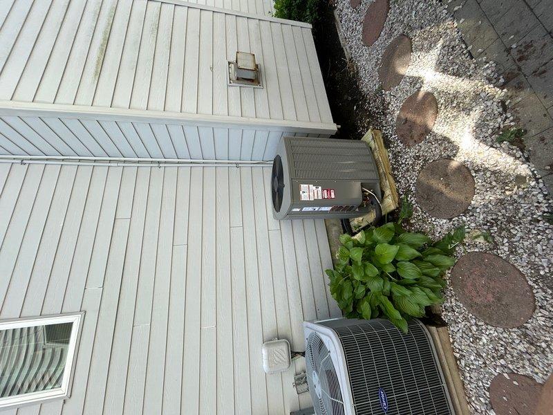 Completed full HVAC system replacement for upstairs zone. Removed and properly disposed of existing equipment. Installed new Lennox EL19KPV-036 3-ton 19 SEER variable speed heat pump outdoor unit on pressure-treated wood platform against exterior wall. Mounted CBK45UHVT-036 variable speed air handler indoors with filter access at unit. Integrated Lennox 10kW electric heat pack for supplemental heating capacity. Fabricated and installed metal duct transitions to adapt new equipment to existing ductwork infrastructure. Reused existing refrigerant lines and condensate drain piping. Replaced outdoor electrical disconnect and electrical whip to meet current code requirements. Installed Honeywell digital WiFi thermostat for remote system control and monitoring. Verified all electrical connections, refrigerant charge, airflow, and system operation. Unit tested and operating to manufacturer specifications. System ready for service.