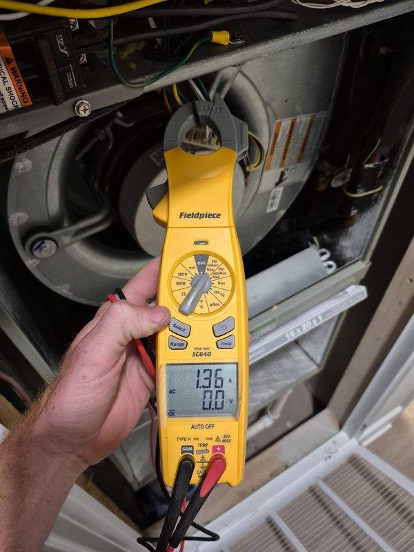 Completed routine cooling maintenance visit on HVAC system. Performed diagnostic testing using digital multimeter to verify system electrical readings, measuring voltage at 392V and amperage draw at 136A. Inspected and tested capacitor connections, control board wiring, and blower motor assembly to ensure proper operation and system efficiency for the cooling season.