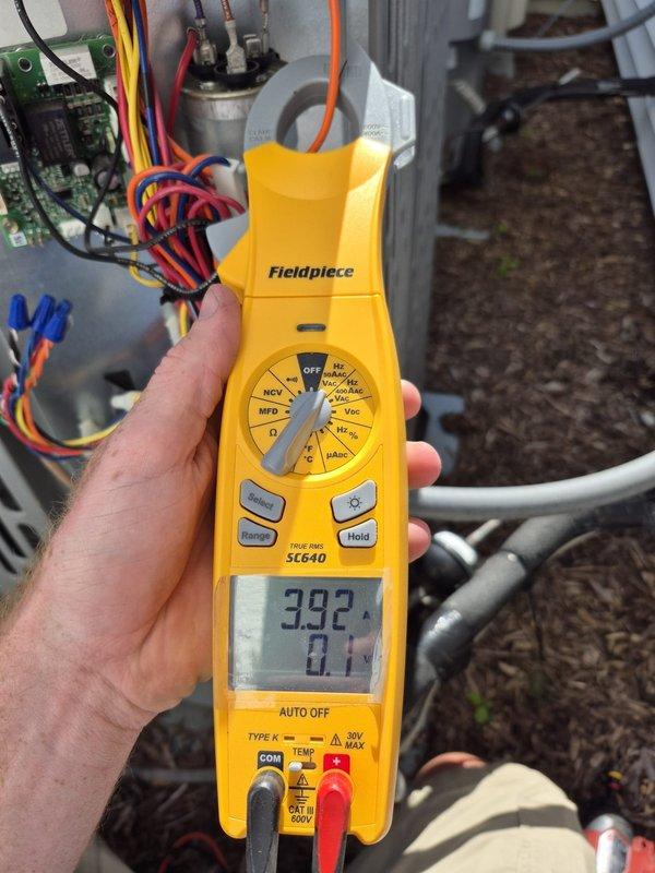 Completed routine cooling maintenance visit on HVAC system. Performed diagnostic testing using digital multimeter to verify system electrical readings, measuring voltage at 392V and amperage draw at 136A. Inspected and tested capacitor connections, control board wiring, and blower motor assembly to ensure proper operation and system efficiency for the cooling season.