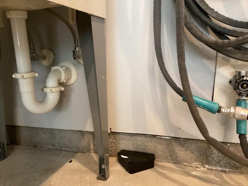 Performed preventive maintenance on wall-mounted tankless water heater unit, including flushing system with descaling solution using pump and bucket setup to remove mineral buildup from heat exchanger. Inspected all internal components, verified proper operation of burner assembly and venting system, and checked water and gas connections for leaks. Additionally discussed customer's request for future estimate to relocate utility sink in garage area.