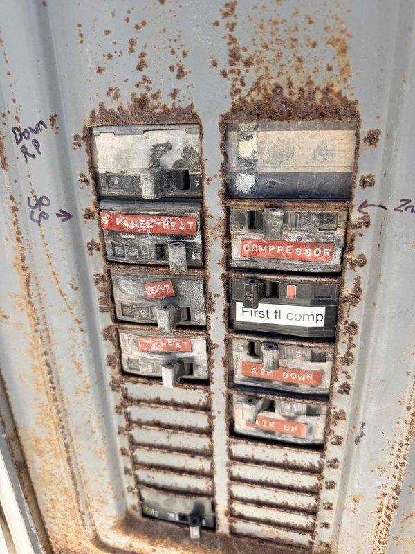 Responded to a no-cooling call and found the HVAC system completely flat on refrigerant with multiple leak points throughout. Upon inspection, the unit showed significant age-related deterioration, including severe rust and corrosion on the electrical panel and surrounding components, indicating prolonged moisture exposure. Due to the extensive leak damage and overall poor condition of the aging system, provided the property owner with a replacement estimate, as repair would not be cost-effective given the multiple failure points and compromised system integrity.