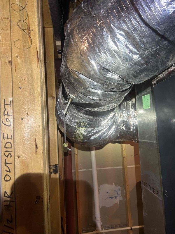 Completed preventative maintenance cooling system inspection on multi-zone HVAC system. Inspected and photographed HZ322 zone control panel with multiple heating and cooling zones, verified all indicator lights and digital display functionality, and checked terminal connections for proper wiring integrity. Inspected ductwork insulation and air handler unit in mechanical space, confirming proper installation and operation of flexible duct system with reflective insulation wrapping and reinforcement bands intact.