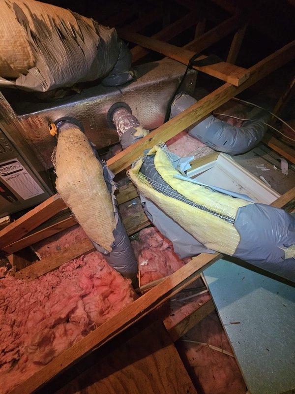 Responded to no cooling call on residential HVAC system less than 10 years old. Upon arrival, accessed attic space and inspected air handler unit and associated ductwork system. Verified system components, checked unit operation, and documented existing installation with flexible and rigid ductwork properly insulated throughout attic space. System restored to normal cooling operation.