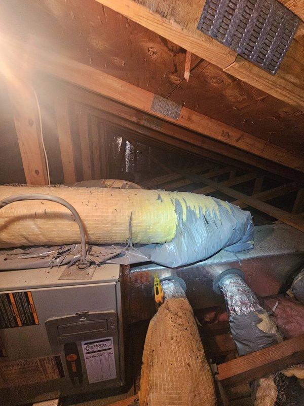 Responded to no cooling call on residential HVAC system less than 10 years old. Upon arrival, accessed attic space and inspected air handler unit and associated ductwork system. Verified system components, checked unit operation, and documented existing installation with flexible and rigid ductwork properly insulated throughout attic space. System restored to normal cooling operation.