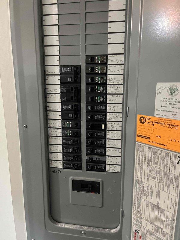 # HVAC Service Call Summary

Responded to no air conditioning complaint at residential property. Upon arrival, inspected outdoor condensing unit and electrical service panel. Unit is 10+ years old and located on exterior concrete pad with adequate clearance. Verified electrical connections at breaker panel, documented system configuration, and assessed overall equipment condition. Photographed electrical panel labeling and outdoor unit installation for service records.

# Detailed Work Performed

Arrived at property during scheduled service window to diagnose air conditioning system failure. Conducted visual inspection of outdoor condensing unit positioned on concrete pad along exterior wall. Unit showed typical age-related wear consistent with 10+ year operation. Refrigerant line set properly secured to building exterior with black insulation intact.

Inspected main electrical service panel to verify circuit breaker configuration and proper labeling. All circuits clearly marked with h