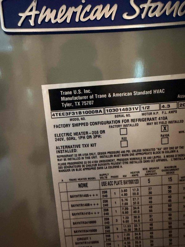 Provided estimate for replacement of existing American Standard air handler system. Unit is currently operational but aging, located in interior closet alcove with existing ductwork infrastructure. Documented existing Trane-manufactured equipment (Model 4TEE3F31B1000BA) with specifications for replacement planning.