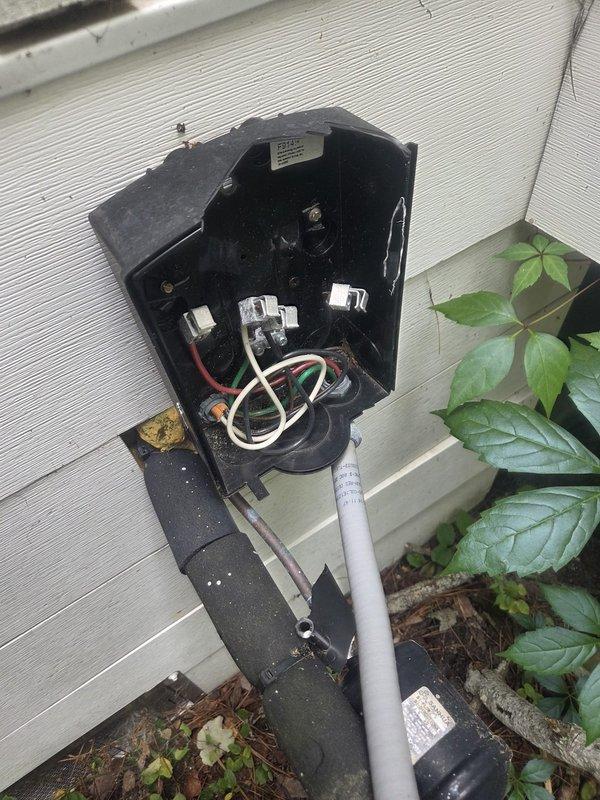 Responded to no cooling call. Upon arrival, inspected outdoor unit and electrical disconnect box mounted on exterior wall. Found disconnect switch in off position. Verified all wire connections were secure and intact within the weathered disconnect enclosure. Restored power by closing disconnect switch. System powered on successfully and began operating normally. Confirmed cold air delivery at indoor registers. Unit returned to proper cooling operation.