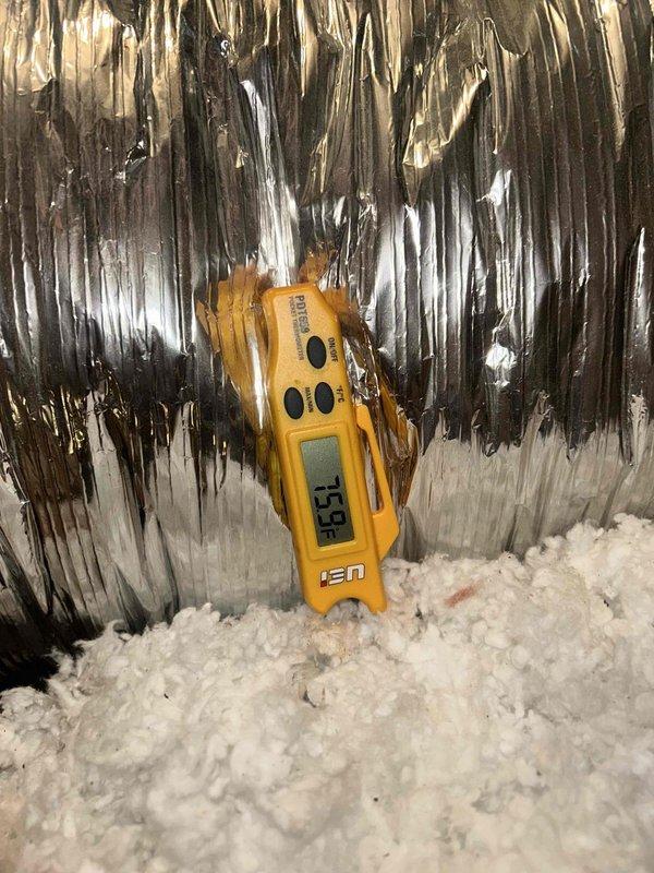 Responded to no cooling complaint on unit less than 10 years old. Upon arrival, found system running but not cooling adequately with excessive noise reported. Performed diagnostic temperature measurements at supply and return locations using digital thermometer. Supply air temperature measured 39.5°F at ductwork in attic space, while return air measured 55.9°F, indicating inadequate temperature split of approximately 16 degrees. Normal temperature differential should be 18-22 degrees for proper cooling performance. Inspected attic-mounted equipment and ductwork for visible issues. No refrigerant leaks detected during visual inspection. Unit remains noisy and not cooling to desired temperature. Further diagnostics required to identify root cause of insufficient cooling capacity and abnormal noise levels. Possible issues include low refrigerant charge, compressor inefficiency, airflow restrictions, or mechanical component failure requiring additional testing and repair.