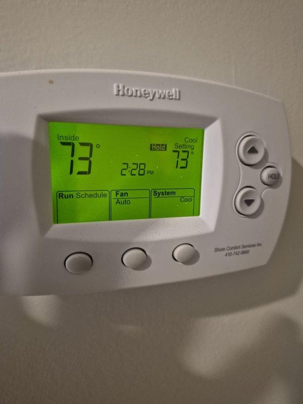 Responded to no cooling complaint on main floor. Upon arrival, verified thermostat set to cooling mode at 73°F with system calling for cooling but indoor temperature reading 73°F. Inspected attic-mounted air handler and ductwork system. Found approximately 18-19 inches of flex duct with compromised insulation and exposed backing material on supply trunk line. Identified control board wiring connections on duct-mounted component. System operational with thermostat communicating properly to equipment. Documented conditions with photos for customer records.