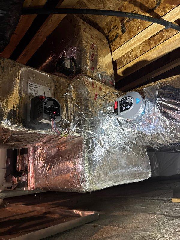Installed complete HVAC zoning system including HZ432 zone control board, two ZD10X10 dampers, one ZDZ0X14 damper, and CPRD8 8" bypass damper in attic space. Mounted THM5320R100 equipment interface module and THM4000R1000 wireless adapter to enable wireless thermostat communication. Installed TH5320R1002/U Wireless FocusPro and TH8321R10001/U programmable thermostats to provide independent temperature control for multiple zones throughout the residence. All zone dampers properly wired to control board, bypass damper installed to maintain proper static pressure within ductwork system, and wireless components paired and tested for reliable communication. System commissioned with all zones responding correctly to thermostat calls, dampers opening and closing as programmed, and bypass damper functioning to prevent over-pressurization. One-year labor warranty provided on installation.
