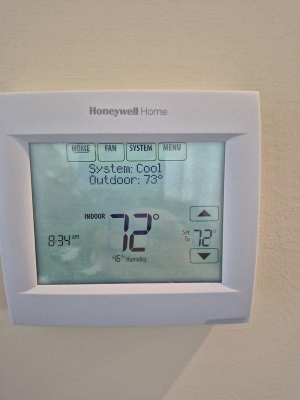 Completed routine cooling maintenance visit on two HVAC systems. Performed electrical diagnostics using clamp meter, measuring amperage draw at 9.36A to verify compressor performance and system efficiency. Verified thermostat operation showing 72°F indoor temperature with 46% humidity, system cooling properly with outdoor temperature at 73°F. Both systems operating within normal parameters with no issues identified.