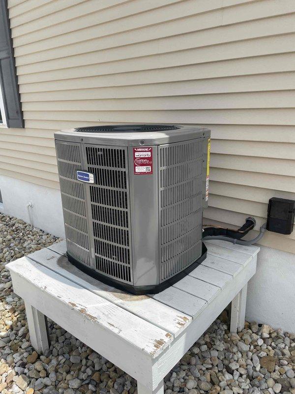 Completed full HVAC system replacement including removal and disposal of existing equipment. Installed American Standard 5A6H4030A1000A 2.5-ton 14 SEER heat pump with matching American Standard 5TEM4B03AC31 air handler and BAYHTR1510 10 kw electric heat pack. Fabricated and installed metal duct transitions to adapt new equipment to existing ductwork. Reused existing refrigerant lines and condensate drain. Replaced outdoor electrical disconnect and whip to meet current code requirements. Positioned outdoor unit on existing equipment stand with proper clearances. Installed Honeywell digital WiFi thermostat and completed system programming. Verified all electrical connections, tested system operation in both heating and cooling modes, and confirmed proper airflow and refrigerant charge. System operating within manufacturer specifications with one-year parts and labor warranty from installation date.