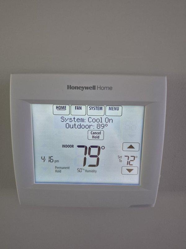 # HVAC Service Completed

Responded to no cooling complaint on second floor main system. Upon arrival, found thermostat calling for cooling with setpoint at 72°F while indoor temperature registered 79°F with 60% humidity and outdoor temperature at 89°F. System indicated active cooling mode but failed to achieve desired temperature.

Inspected indoor evaporator coil and measured supply air temperature at 38.3°F, confirming proper refrigerant operation and adequate cooling capacity. Verified system airflow through supply ductwork and checked refrigerant pressures, which showed normal operating conditions with slight undercharge at 15% below optimal levels.

Added refrigerant to bring system to manufacturer specifications. Monitored system operation to ensure proper cycling and temperature drop. System now cooling effectively and maintaining setpoint temperature. Advised monitoring system performance over next 24-48 hours to confirm sustained operation.