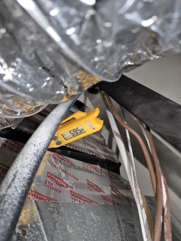 # HVAC Service Completed

Responded to no cooling complaint on second floor main system. Upon arrival, found thermostat calling for cooling with setpoint at 72°F while indoor temperature registered 79°F with 60% humidity and outdoor temperature at 89°F. System indicated active cooling mode but failed to achieve desired temperature.

Inspected indoor evaporator coil and measured supply air temperature at 38.3°F, confirming proper refrigerant operation and adequate cooling capacity. Verified system airflow through supply ductwork and checked refrigerant pressures, which showed normal operating conditions with slight undercharge at 15% below optimal levels.

Added refrigerant to bring system to manufacturer specifications. Monitored system operation to ensure proper cycling and temperature drop. System now cooling effectively and maintaining setpoint temperature. Advised monitoring system performance over next 24-48 hours to confirm sustained operation.