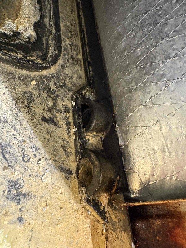 Responded to service call for HVAC unit leaking into crawlspace. Upon inspection, found excessive condensation accumulation on metal ductwork surfaces and significant water damage evident on concrete floor at duct junction with dark staining and moisture infiltration. Documented conditions showing condensation on rigid and flexible ductwork components, moisture buildup at seams, and biological growth at floor-to-duct interface indicating prolonged water intrusion issue. Customer notified of findings and advised of recommended corrective actions.