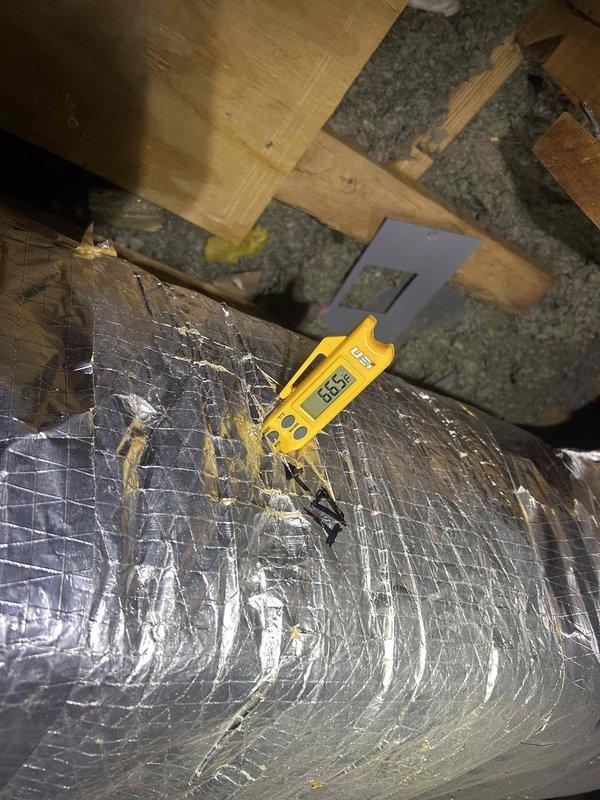 Responded to no cooling complaint on air handler system. Upon arrival, accessed attic space and located air handling unit with associated ductwork. Performed temperature diagnostics on supply duct system using digital thermometer, recording supply air temperatures of 80.8°F and 80.5°F at multiple measurement points. These elevated supply air temperatures confirmed lack of cooling operation and indicated system was circulating air without refrigeration cycle functioning properly. Documented conditions with photos showing ductwork configuration and temperature readings. Further diagnostics required to determine root cause of cooling failure, which may include compressor malfunction, refrigerant loss, electrical component failure, or control system issues.