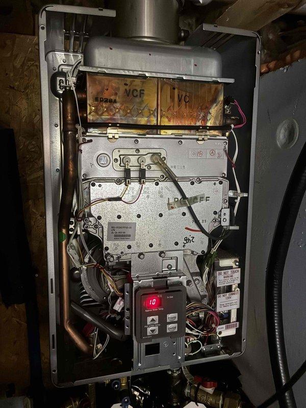 Responded to no hot water complaint at rental property. Upon inspection, diagnosed water heater failure requiring replacement. Documented existing equipment condition and installation location in attic space. Assessed gas supply lines, venting system, and condensate drainage configuration. Coordinated expedited water heater replacement to restore hot water service as quickly as possible.