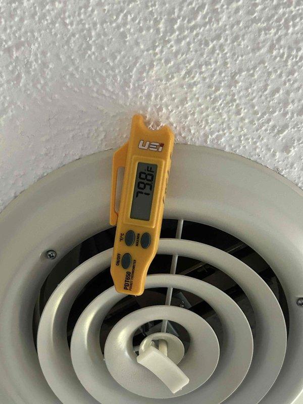 Responded to no cooling complaint on residential HVAC system. Upon arrival, verified unit was blowing warm air from supply diffuser with temperature reading of 198°F, indicating system running in heating mode. Instructed customer to power off equipment at thermostat to prevent further operation in incorrect mode and avoid potential comfort issues until proper system settings could be restored.