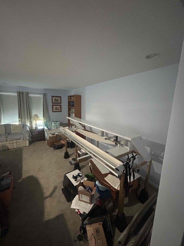 Responded to emergency service call for eight-year-old air conditioning system running but not producing adequate cooling. Performed diagnostic inspection of interior HVAC components and documented system conditions with photographic evidence for service records.