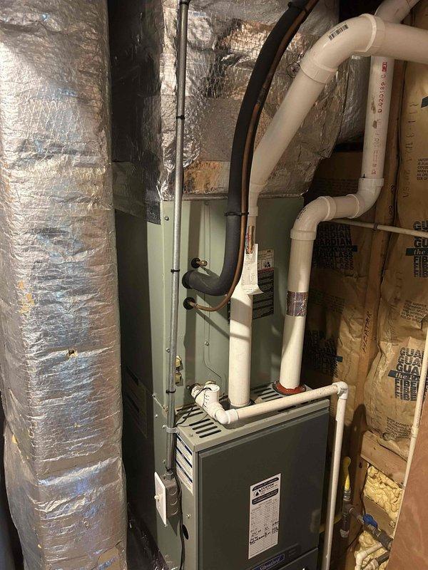 Responded to customer concern regarding system not adequately cooling the home. Upon arrival, performed comprehensive diagnostic evaluation of 13-year-old American Standard split system including air handler and furnace components. Inspected all major system components, verified proper operation of equipment, checked refrigerant levels, evaluated airflow through supply and return ductwork, and assessed overall system performance against manufacturer specifications. Documented existing installation configuration with photos showing air handler unit, associated ductwork with reflective insulation, furnace with PVC venting system, and mechanical room layout. Advised customer that system is operating within normal parameters for equipment of this age and that cooling capacity may be limited due to normal wear and efficiency degradation over time. No immediate repairs required at this time.