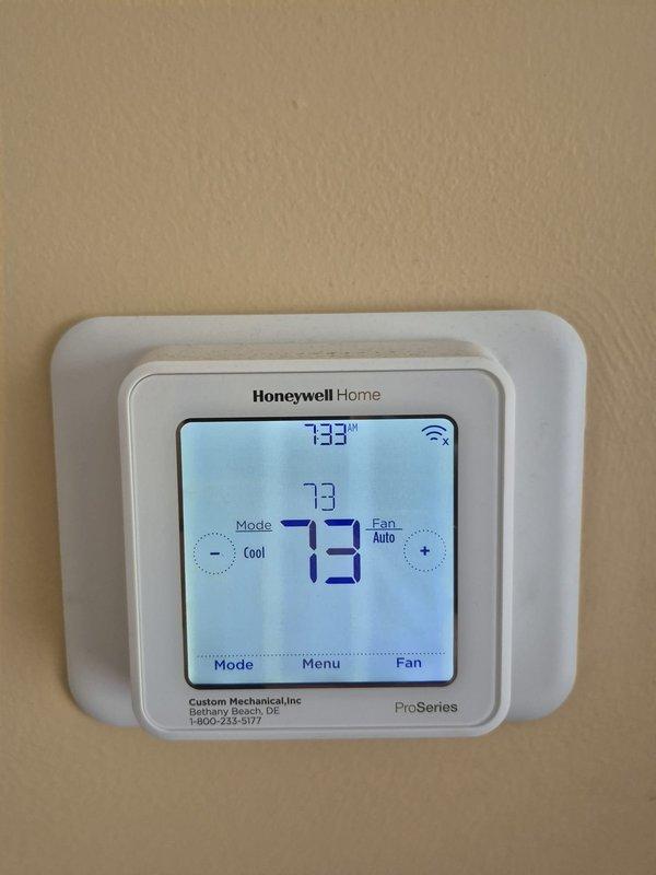 Installed Honeywell T6 ProSeries WiFi thermostat to replace existing unit, programmed system settings for cooling operation with auto fan mode, and verified proper communication between thermostat and HVAC equipment. Performed system diagnostics and temperature measurements on ductwork, recording supply air temperature of 22.5°F differential to confirm adequate cooling performance and proper refrigerant charge levels.