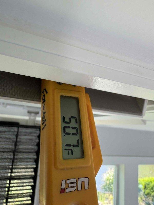 Responded to no cooling call on ductless mini-split system. Upon arrival, unit was inoperative and not responding to commands. Performed diagnostic temperature measurements at indoor unit, recording supply air temperatures of 63°F and 53.2°F at different locations on the unit housing. Verified unit functionality and restored cooling operation to system.