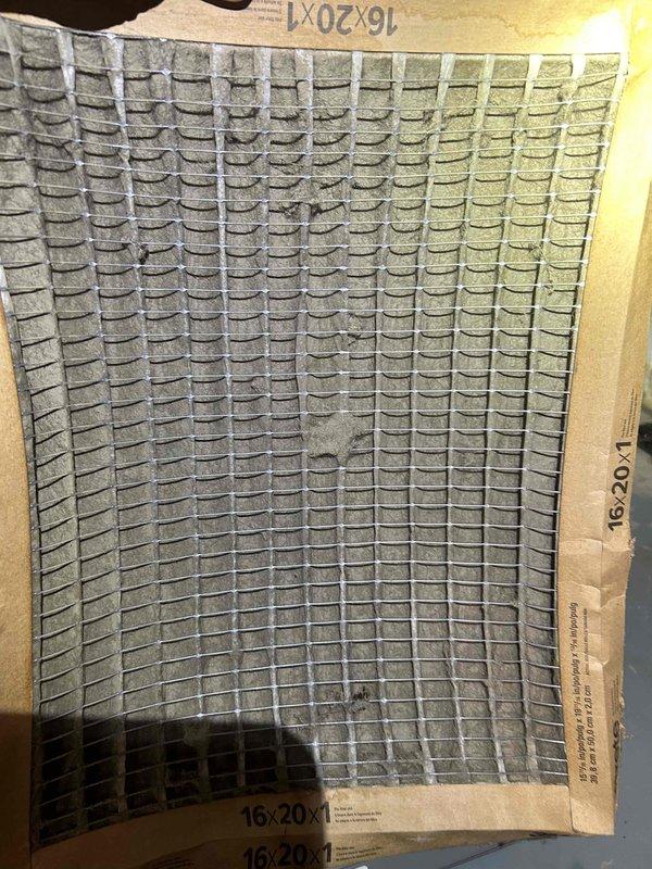 Responded to no cooling complaint on residential HVAC system. Upon arrival, accessed system in utility space and performed diagnostic evaluation. Measured supply air temperature registering 51.87°F, indicating adequate cooling performance. Inspected air filter measuring 16x20x1 and found moderate dust accumulation restricting airflow. Replaced dirty filter with new unit to restore proper system airflow and efficiency. Verified system operation and confirmed adequate cooling delivery throughout occupied space. System returned to normal operation after filter replacement.