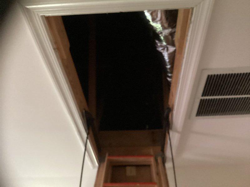 Performed estimate for replacement of 11-year-old HVAC system located in attic with pulldown stair access. System confirmed to be out of refrigerant and evaluated for complete replacement rather than repair due to age and condition. Documented existing equipment configuration and attic access conditions for replacement proposal.