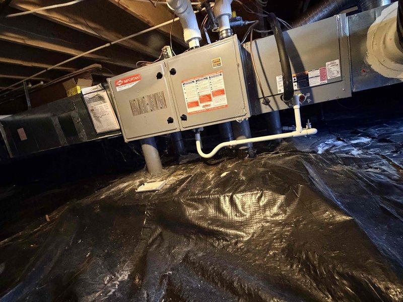 Conducted HVAC system replacement estimate for a 13-year-old unit with failed compressor. Assessed existing air handler installation located in crawlspace with proper vapor barrier and condensate drainage configuration. Documented equipment specifications and access conditions, noting crawlspace entry point with adequate clearance for replacement equipment installation.
