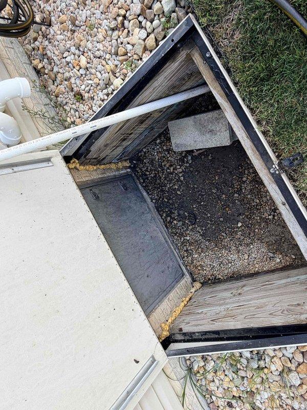 Conducted HVAC system replacement estimate for a 13-year-old unit with failed compressor. Assessed existing air handler installation located in crawlspace with proper vapor barrier and condensate drainage configuration. Documented equipment specifications and access conditions, noting crawlspace entry point with adequate clearance for replacement equipment installation.