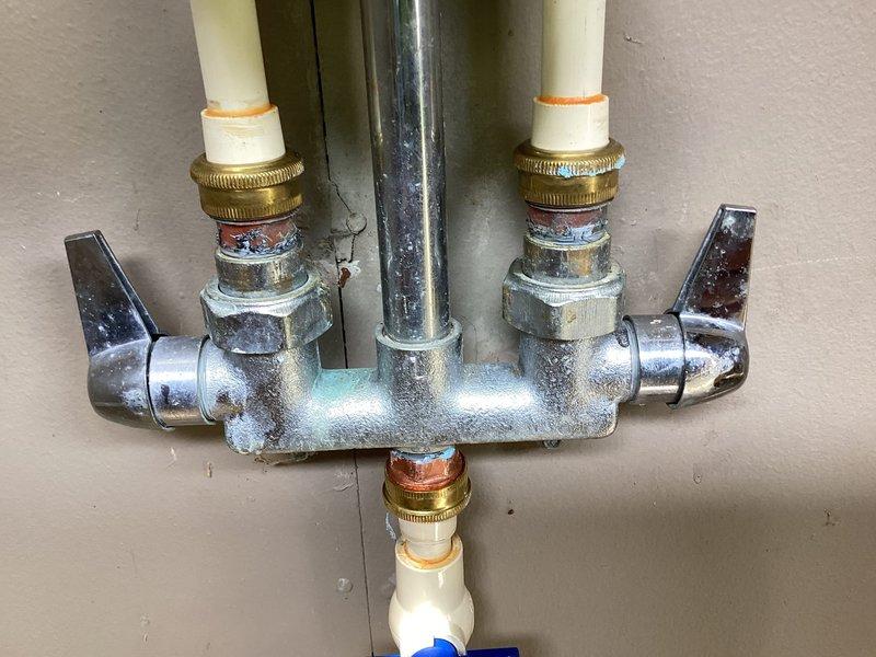 Completed full repipe of both hot and cold water supply lines for outdoor shower enclosure damaged by freezing temperatures. Installed new 1/2" CPVC piping with proper pitch and slope to enable gravity drainage, incorporating two additional 1/4 turn boiler drains at strategic locations to prevent future freeze damage. Utilized brass tees, copper male adapters, high-temperature CPVC adapters, ball valve, and appropriate blocking materials with clamps and fasteners to secure all lines according to code requirements.
