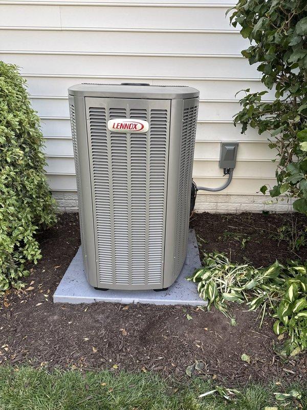 Completed full HVAC system replacement including removal and disposal of existing equipment. Installed Lennox EL19KPV-060 5-ton 19 SEER variable speed heat pump on exterior concrete pad with snow legs as requested. Indoor installation consisted of Lennox CBK45UHVT-060 variable speed air handler with 20 kW electric heat pack mounted in basement utility area. Fabricated and installed metal duct transitions to adapt new equipment to existing ductwork. Reused existing refrigerant lines and condensate drainage while replacing outdoor disconnect box and electrical whip to meet current code requirements. Installed Honeywell zone control board (1C1008K) with two Honeywell digital WiFi thermostats for multi-zone temperature management. All electrical connections completed and system tested for proper operation across all zones. Verified refrigerant charge, airflow, and heating/cooling capacity meet manufacturer specifications.