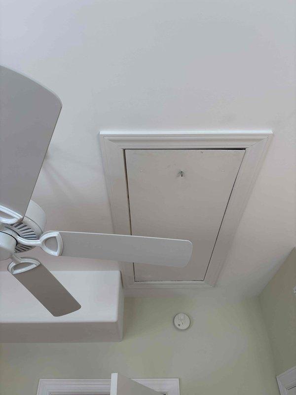Responded to no cooling complaint. Upon arrival, found thermostat displaying error code -79, indicating a communication or sensor malfunction. Inspected wall-mounted thermostat and verified system settings. Documented equipment conditions with photos showing thermostat interface and attic access location for future reference. Advised customer of findings and discussed diagnostic results.